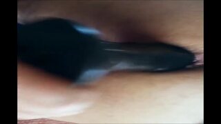 Asshole stretching with massive strapon dildo