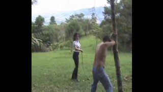 Bullwhipping a bad slave in the forest