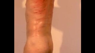 Dominatrix Spanks and Whips Bound Male Slave in BDSM Femdom Session