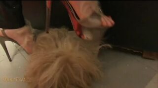 Male slave trapped under a chair gets foot smothered