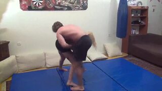 Poor man defeated during mixed wrestling