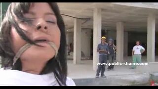 Sexy brunette with long hair in public piazza naked gets humiliated and fucked