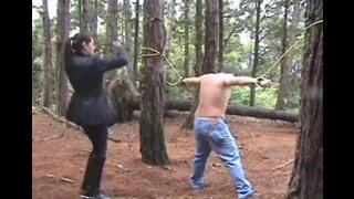Tied in a big tree for complete whipping submission